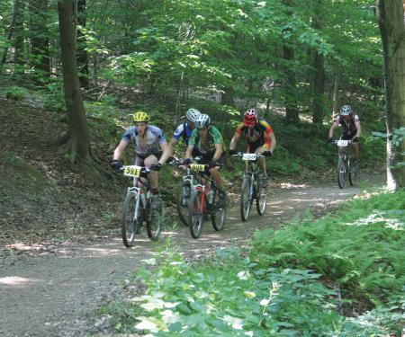 Mountain Bikers racing as part of the Raccoon Rally Cycling Festival at Allegany State Park
