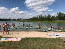 A photo from a past PaddleFest at Spruce Lake