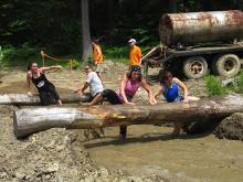 Log obstacle with mudpit during the Mudslide at Holiday Valley